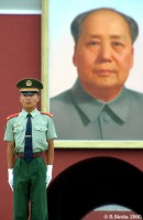 Guard near Mao portrait