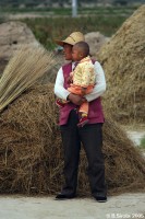 Chinese minority people during autumn harvest