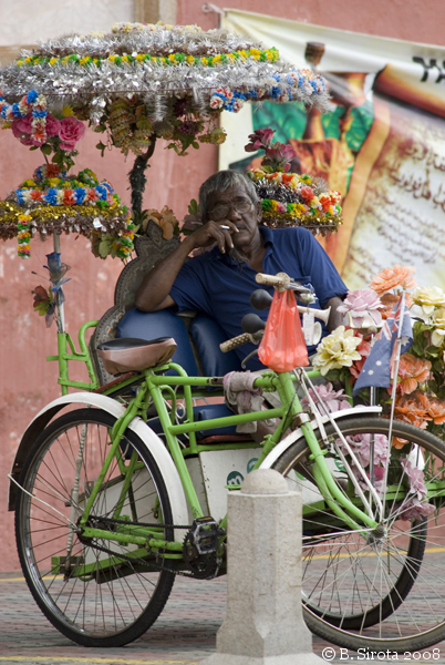 Trishaw driver resting in the ancient city of Malacca